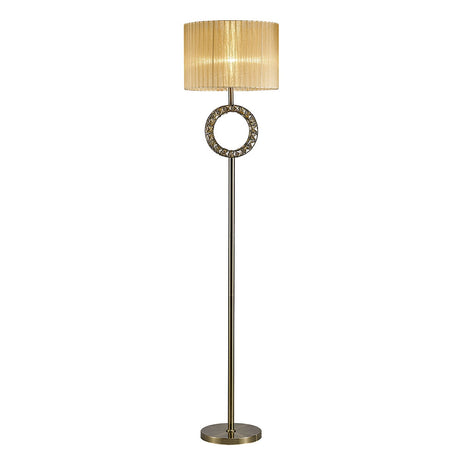 The Florence Round 1 Light Crystal Floor Lamp features a tall, slender brass stand, a decorative circular accent below the bronze shade, and a round base.