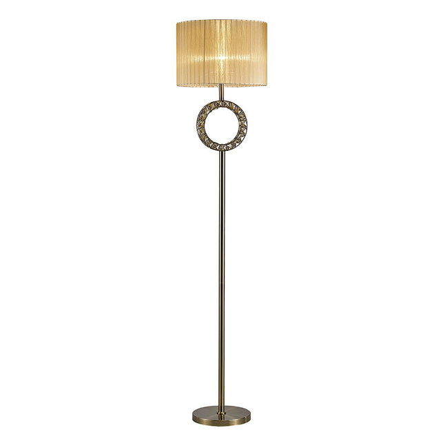 The Florence Round 1 Light Crystal Floor Lamp features a tall, slender brass stand, a decorative circular accent below the bronze shade, and a round base.