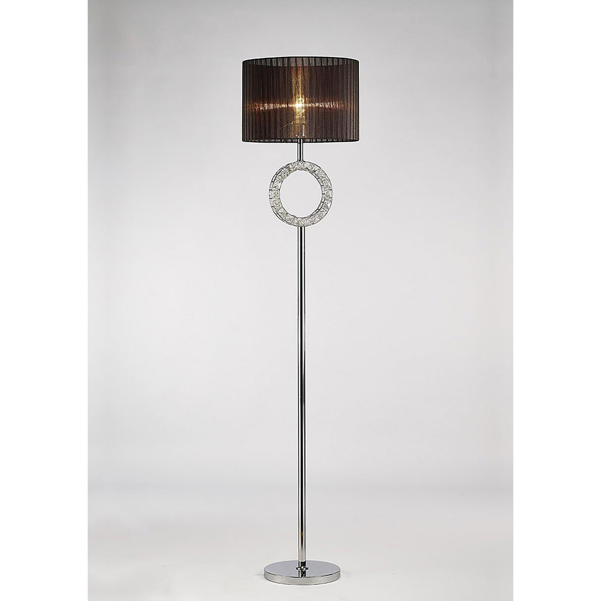 The Florence Round 1 Light Crystal Floor Lamp features a chrome stand, round base, circular crystal accent, and a black semi-transparent drum shade for ambient lighting against a light background.