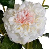 Close-up of Hill Interiors White Garden Rose Spray showing ruffled white petals around a soft pink centre, framed by veined green foliage.