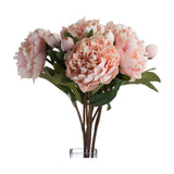 Hill Interiors Peach Peony Rose faux bouquet with layered peach-pink blooms, buds and green leaves arranged in a clear glass vase on white.