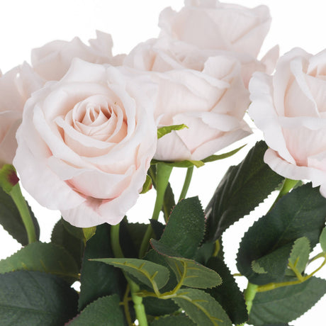 Close-up of Hill Interiors Pastel Pink Tea Rose faux stems showing layered petals and veined green leaves against a white background.
