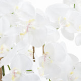 Close-up of Hill Interiors Large White Tall Orchid faux plant showing waxy white petals with yellow centres and red speckled throats on arching stems.