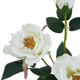 Close-up of the Hill Interiors White Tea Rose faux stem showing ruffled white petals with golden centres and green sculpted leaves against a white background.
