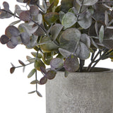 Close-up of the Hill Interiors Small Eucalyptus Cinerea faux plant, showing rounded green and dusky purple-toned leaves rising from a textured grey pot.