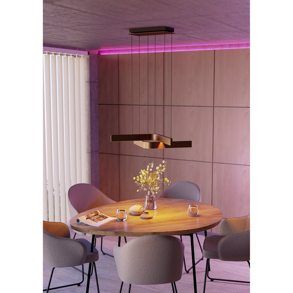 Folcino Smart Colour Changing Pendant Light in bronze and black, with angled aluminium arms suspended on fine wires above a wooden dining table.