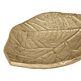 Close-up of the Forleyet Decorative Bowl in gold, a leaf-shaped aluminium dish with raised veins and a textured, pitted surface, shown on a plain white background.