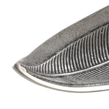 Close-up of the Forleyet Decorative Bowl, a leaf-shaped aluminium dish in antique nickel with embossed rib veining and a speckled textured surface, shown on a white background.