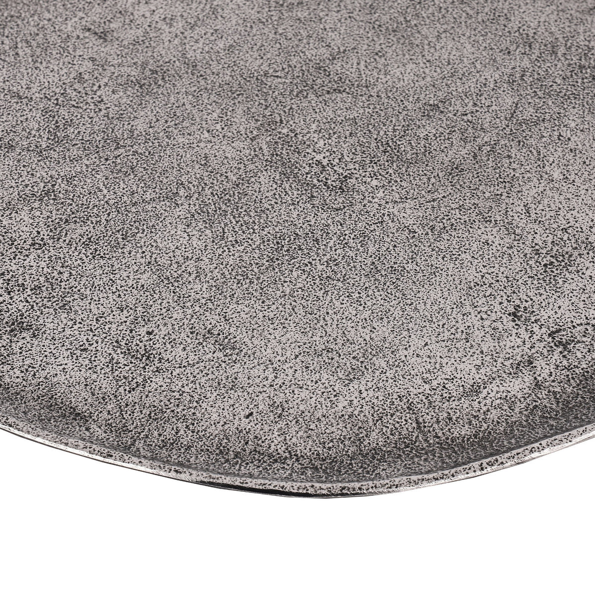 Close-up of the Forleyet shallow oval decorative bowl in aluminium with an antique nickel finish, showing its fine speckled pewter-grey texture and gently uneven rim.