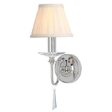 The Finsbury Park 1 Light Wall Light in polished nickel features a white pleated lampshade. Its elegant curved arm and hand-cut glass droplets hanging from the base introduce a touch of sophistication to any space.