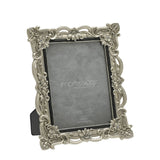 Antique-style silver resin photo frame for a 6x8in photo, with pierced scrollwork, raised flowers, crystal accents at each corner, and a black inner edge, shown on a white background.