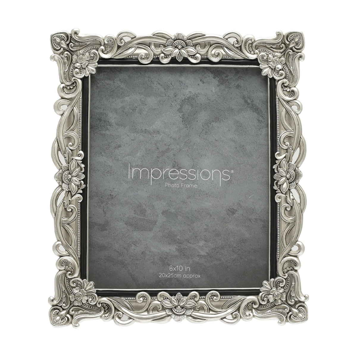Rectangular resin photo frame in silver with raised floral scrollwork and crystal accents at the corners, holding a grey sample print for 8x10in photos on a white background.