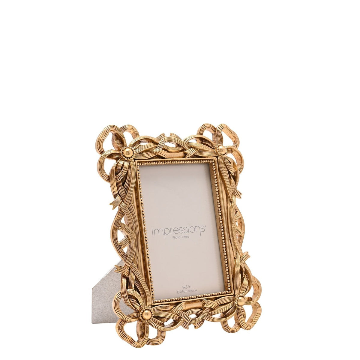 Gold resin photo frame with bowknot corners and openwork ribbon detailing, beaded border, easel back, holding a 4x6in Impressions insert on a plain white background.