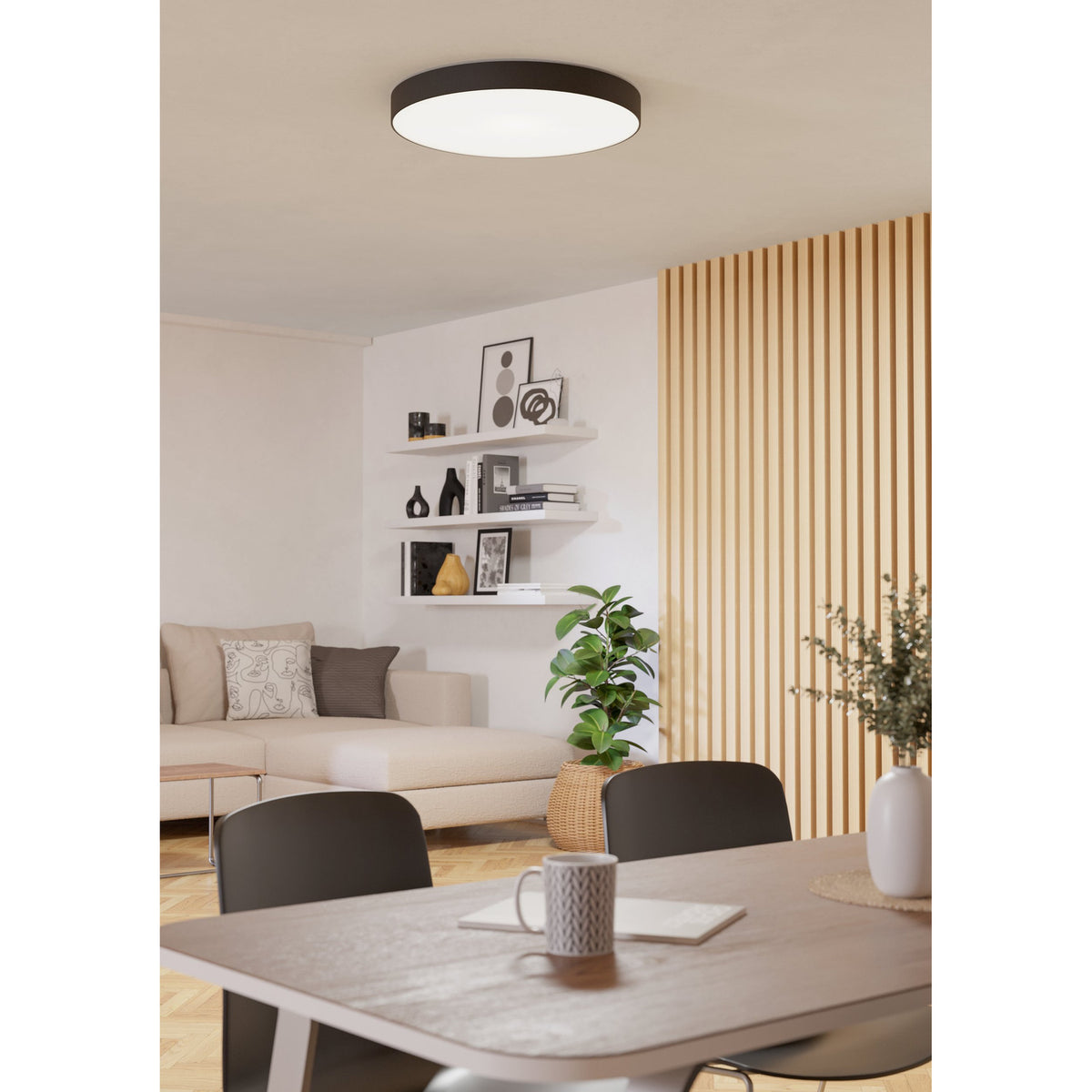 Frelvine Smart LED Flush Ceiling Light 69cm in black, round drum design with white diffuser, shown on a dining and living room ceiling.