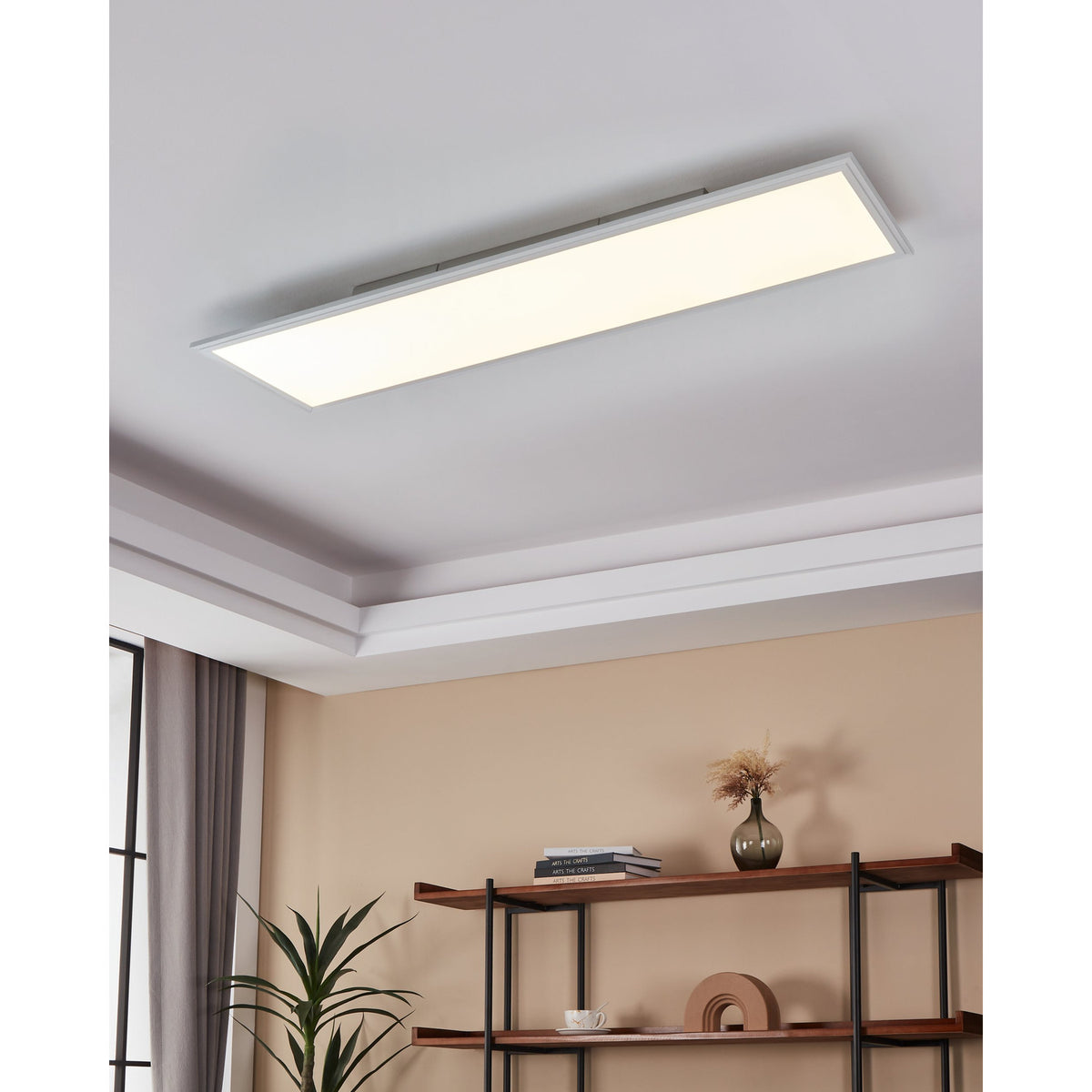 Frinarne LED Panel Light 33W, 120 x 30 x 5cm, white rectangular ceiling-mounted panel with a flat white diffuser, shown recessed into a living room ceiling above a shelf unit.