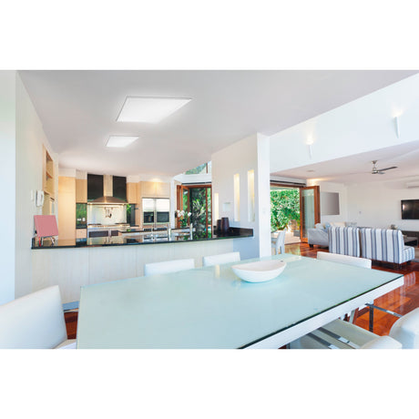 Frinarne 62 x 62cm square LED panel light in white, shown recessed into a kitchen-dining ceiling with a second panel visible nearby.