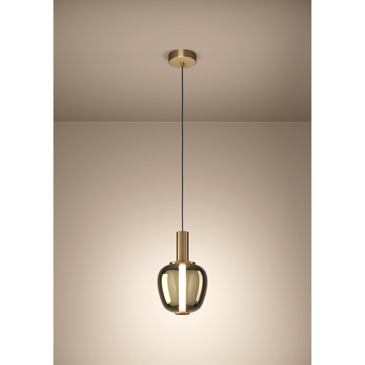 Fruitera Glass Pendant Light 21cm in brushed brass, with an apple-shaped amber-toned glass shade and slim brass neck hanging from a round ceiling canopy against a plain neutral background.