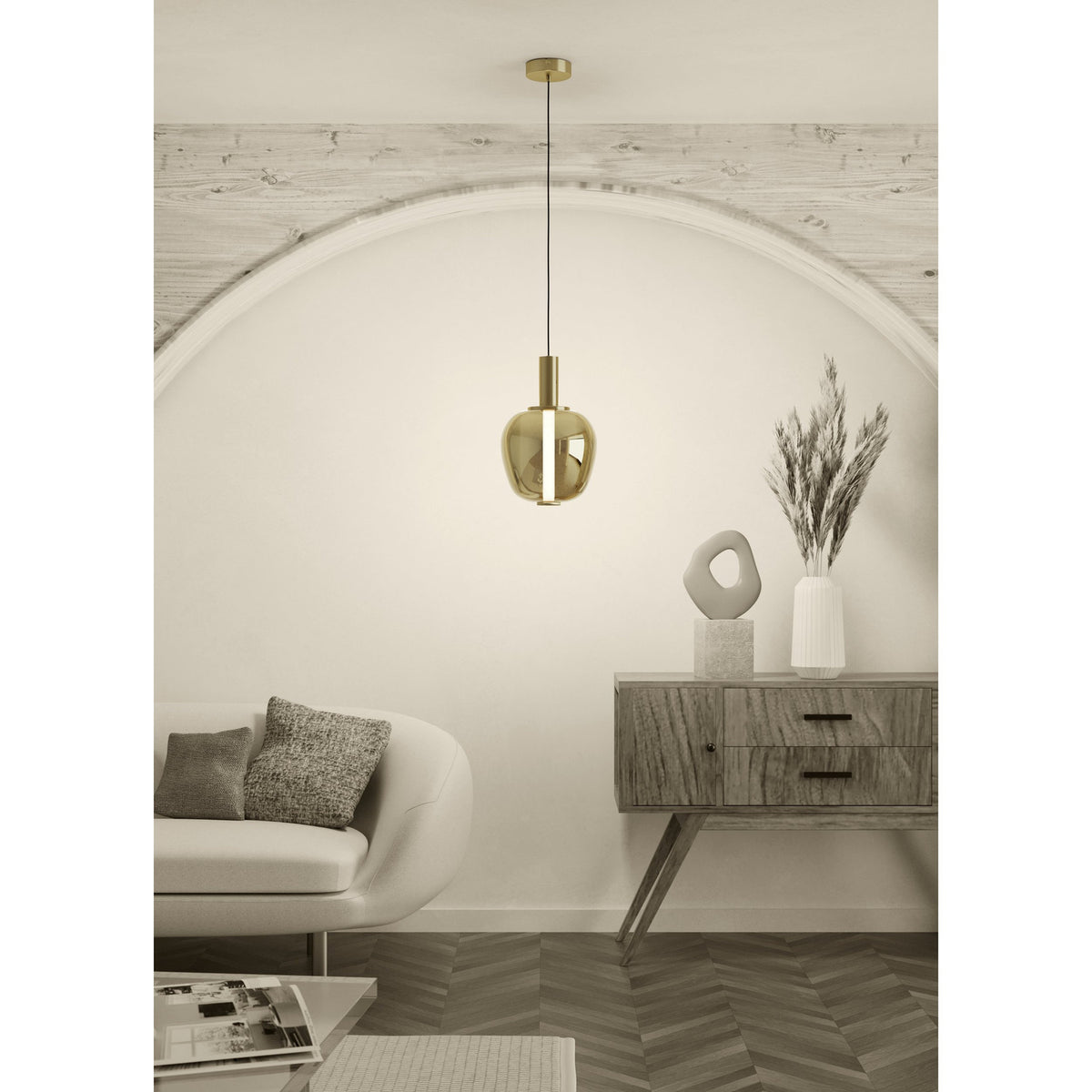 Fruitera Glass Pendant Light 25cm in Brushed Brass with apple-shaped gold glass shade and integrated LED, hung above a console table in a living room setting.