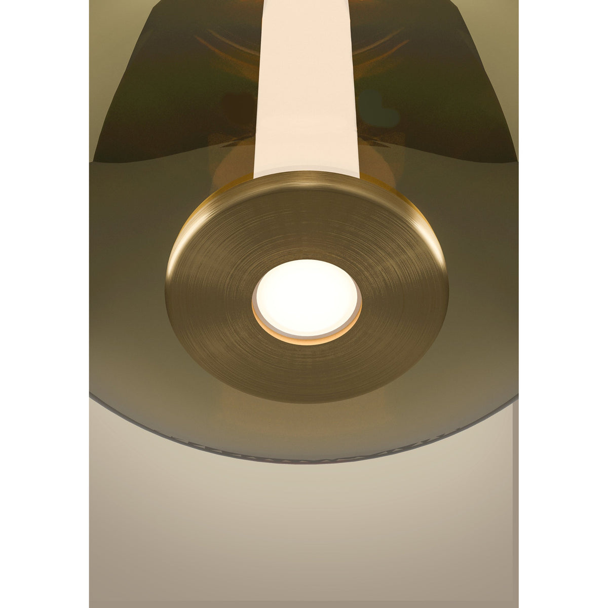 Close-up of the Fruitera glass pendant light showing its brushed brass cylindrical neck and integrated LED centre glowing beneath a pale cord.