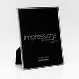 Silverplate photo frame with decorative rose and leaf corners, slim polished silver border holding a 10 x 8in rectangular image, shown angled with easel back on a plain white background.