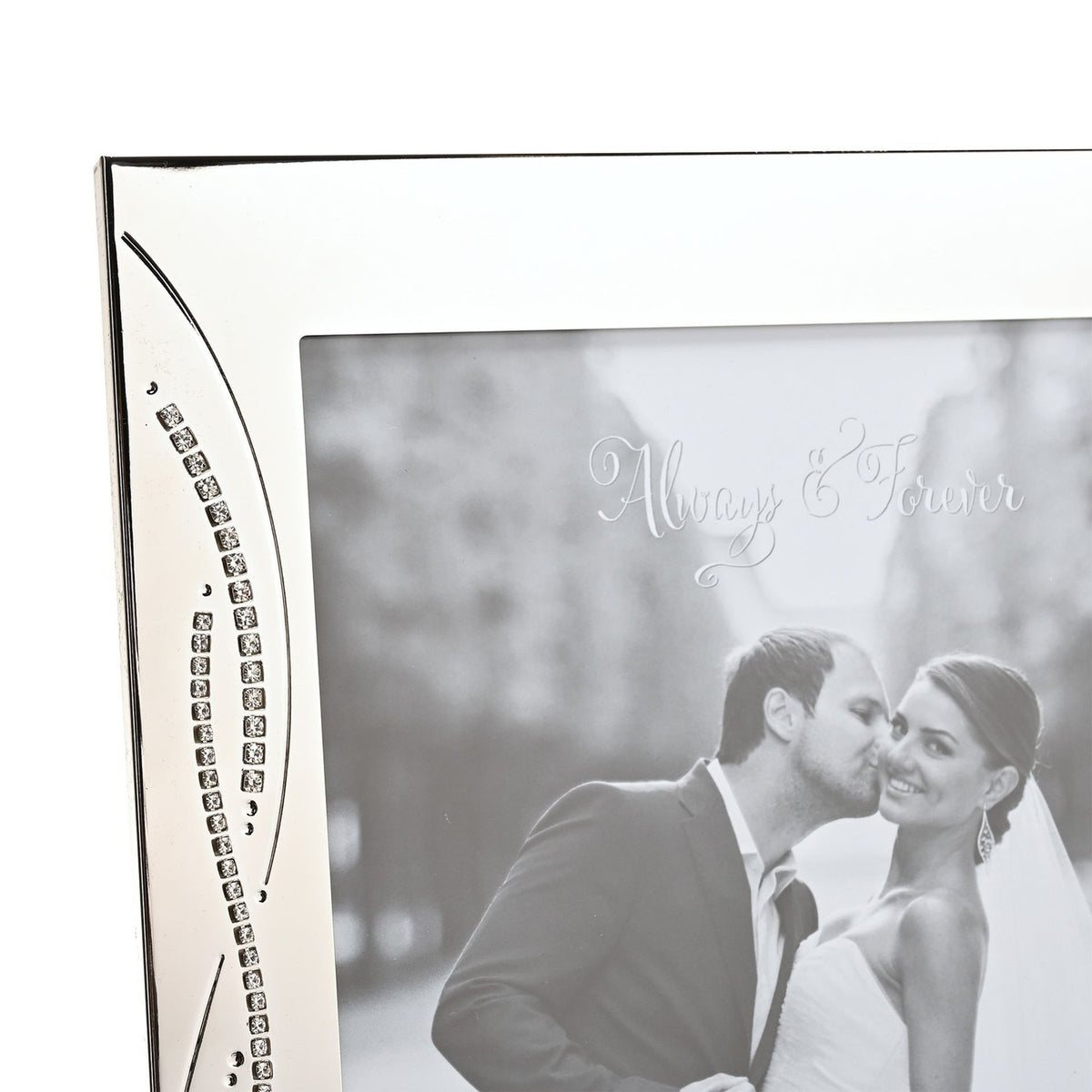 Close-up of the Crystal Reed Design Silverplated Photo Frame 10 x 8in corner, showing polished silver finish with curved reed lines and tiny square crystals beside a black-and-white wedding photo.