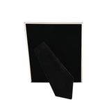 Rectangular silverplated photo frame with a thin crackled-texture border, shown rear view with black velvet backing and attached stand, on a plain white background.