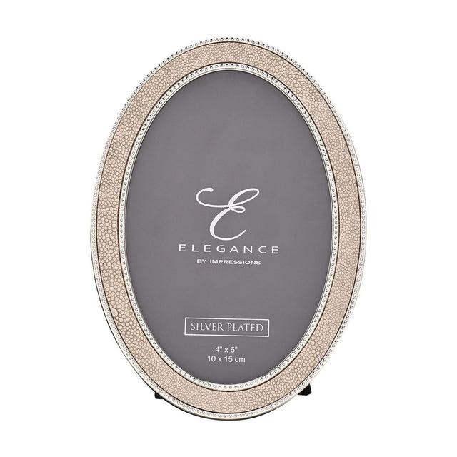 Oval photo frame with cream faux shagreen border and silver-tone beaded edges, holding a 6 x 4in photo, shown on a plain white background.