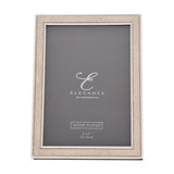 Rectangular photo frame with a champagne faux shagreen border and silver beaded edging, holding a 7 x 5in print, shown on a plain white background.
