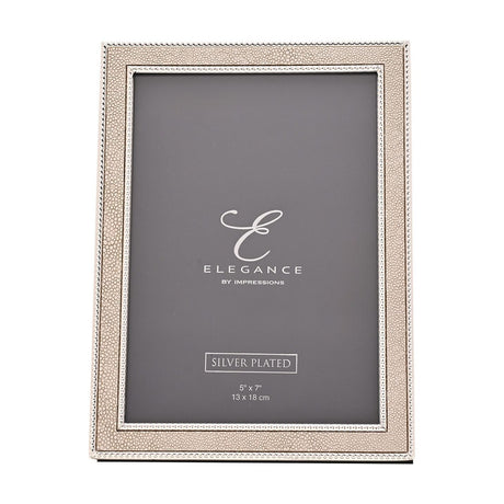 Rectangular photo frame with a champagne faux shagreen border and silver beaded edging, holding a 7 x 5in print, shown on a plain white background.