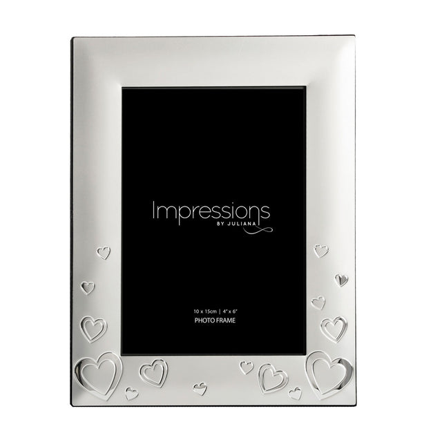 Rectangular silverplated photo frame in satin silver with shiny silver heart outlines and shapes along the base and sides, holding a 4 x 6in photo, shown on a white background.