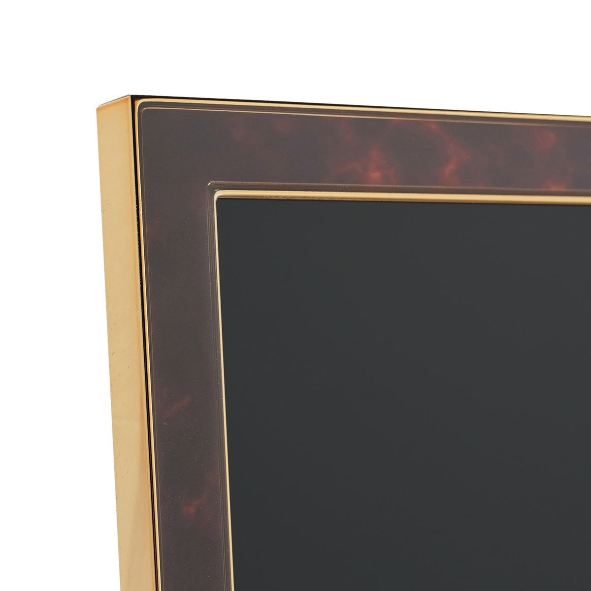 Close-up of a rectangular photo frame corner with a brown tortoiseshell-effect face, gold-tone metal edging, and an inset gold line border, shown on a plain white background.