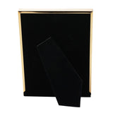Rectangular photo frame with a brown tortoiseshell-effect face and gold-tone metal edging, shown with a black velvet easel stand against a white background.