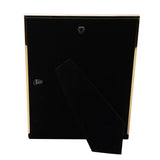 Rear view of the Goldtone Tortoiseshell Metal Photo Frame, showing a black backing panel with a fold-out stand and hanging hook, edged in gold-tone metal.