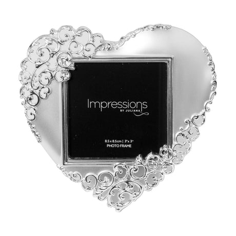 Heart-shaped photo frame in satin silverplate with open scroll detailing around the edges, holding a square 3 x 3in photo insert on a plain white background.