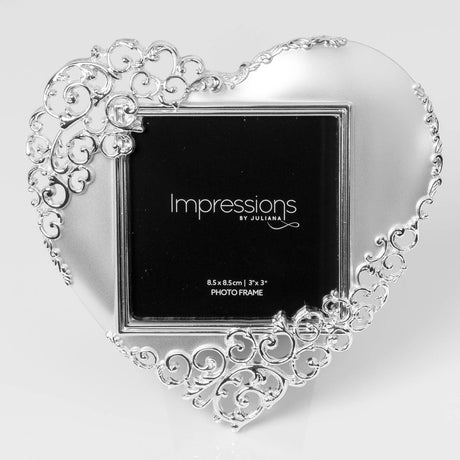 Satin silverplated heart-shaped photo frame with open scroll detailing around the edges, holding a square 3 x 3in photo insert, shown on a plain white background.