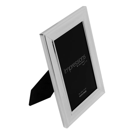 Rectangular silverplated metal photo frame with a fine beaded inner border and smooth sloped surround, shown at an angle on a plain white background.