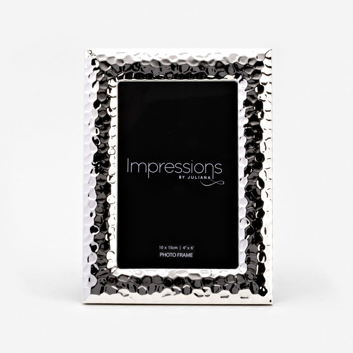 Textured freestanding silverplated photo frame with hammered dimpled border and smooth bevelled edge, holding a 4"x6" rectangular print, shown on a plain white background.