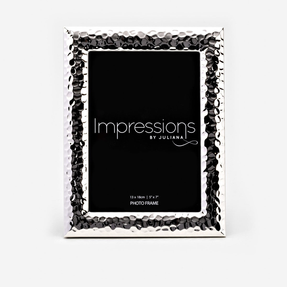 Textured freestanding silverplated photo frame with hammered dimpled border and smooth bevelled edge, rectangular opening for a 5x7" print, on a white background.
