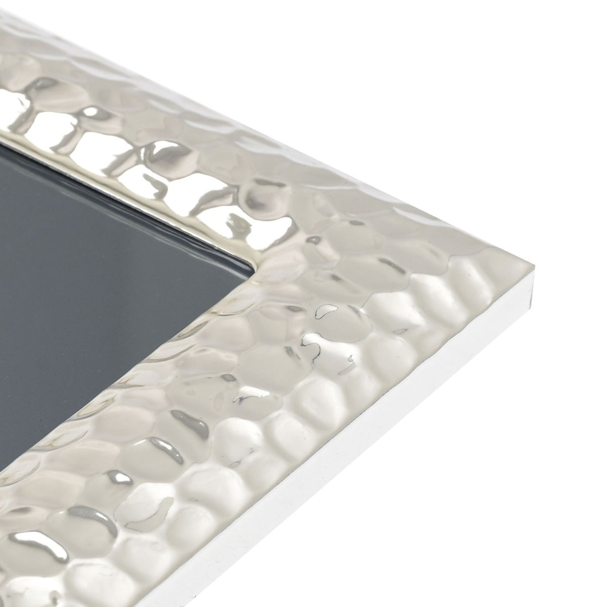 Close-up of the Textured Freestanding Silverplated Photo Frame's corner, showing a dimpled silver border with bevelled edge against a plain white background.