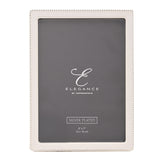 Rectangular photo frame with white epoxy border and silverplated metal, fine silver beading along the outer edge, holding a 5x7in print, shown on a plain white background.