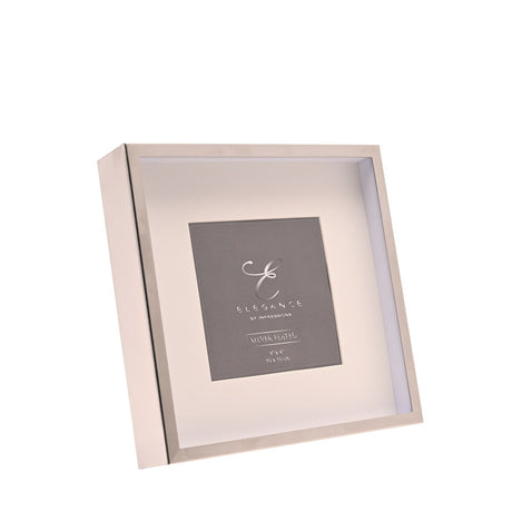 Metal photo frame with silver edge and white mount, square recessed shadow-box style design, shown at an angle on a plain white background.