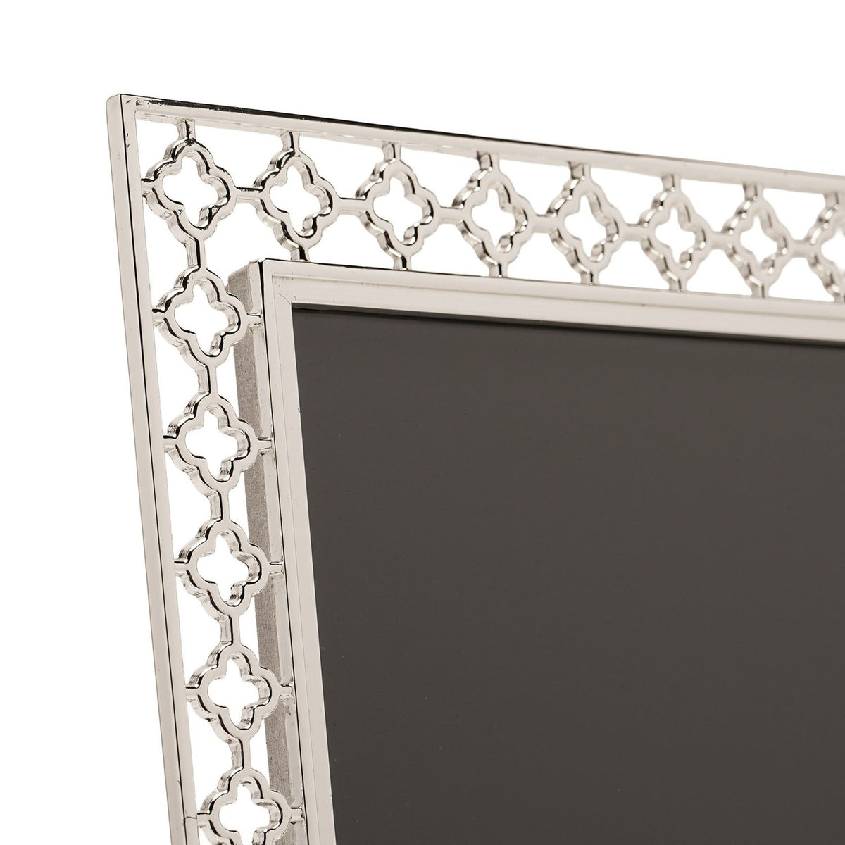 Close-up of the Lattice Cut Silverplated Metal Photo Frame 6 x 4in, showing its silver openwork border with repeating four-petal shapes around a dark insert.