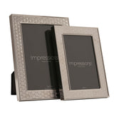 Two silverplated rectangular photo frames with an art deco scallop border pattern, sized 5x7in and 4x6in, standing on a white background.