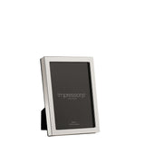 Narrow rectangular silverplated metal photo frame with a slim polished silver border, holding a 4x6in sample insert, shown at an angle on a plain white background.