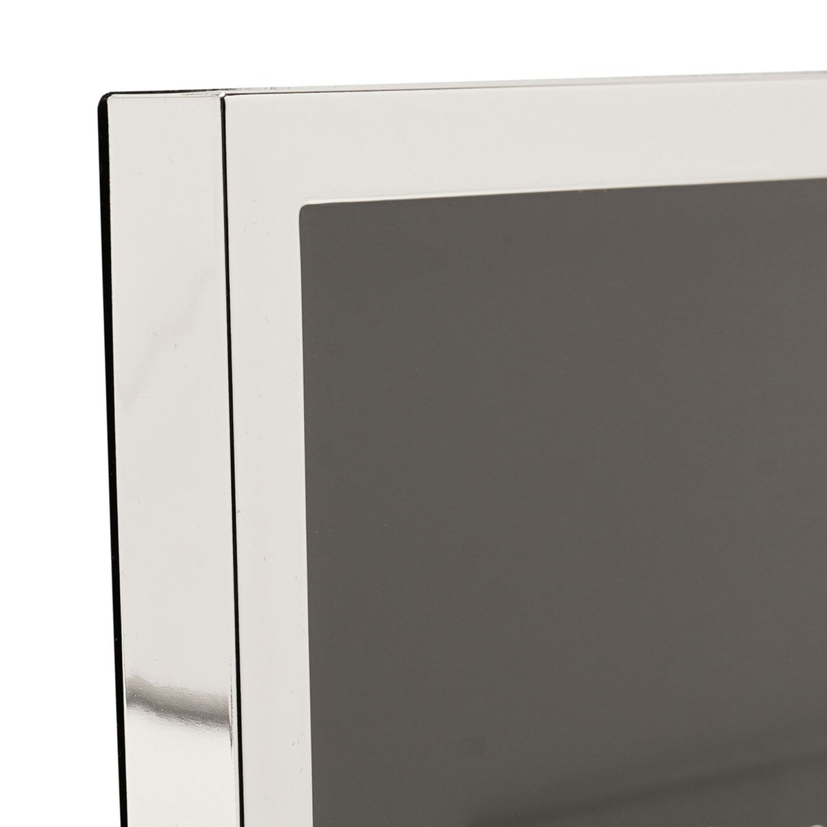 Close-up of the Narrow Rectangular Silverplated Metal Photo Frame corner, showing the slim mirror-finish silver border against a grey photo mount.