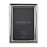 Rectangular silver-plated photo frame with a narrow, smooth polished border and dark insert, holding a 6 x 4in print on a plain white background.