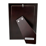 Rear view of the 999 Silverplated Narrow Smooth Photo Frame 6 x 4in, showing a dark wooden back, hanging hook, and an angled kickstand with silver studs on a white background.