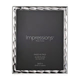 Rectangular wavy bevelled photo frame in silver with a rippled edge border, holding a dark 8x10in insert, shown on a plain white background.