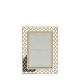 Rectangular 6x4in photo frame with a gold cut-metal quatrefoil lattice border surrounding a smooth raised inner edge, shown on a plain white background.