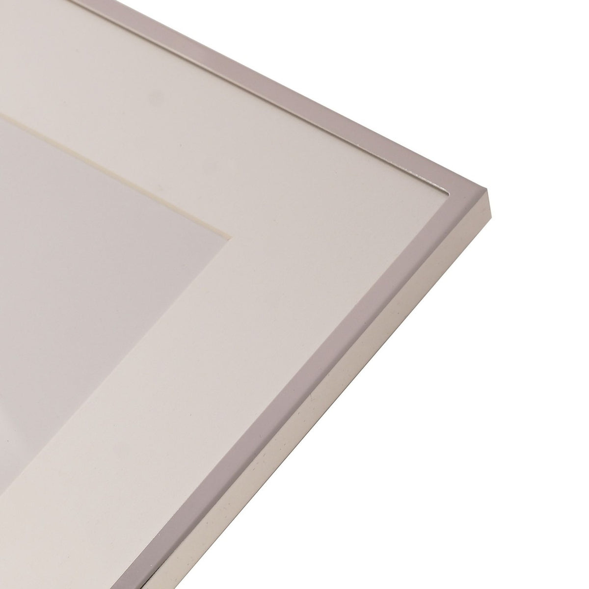 Close-up of a rectangular silverplated photo frame with a slim silver edge and wide white mount for a 6 x 4in print, shown on a plain white background.